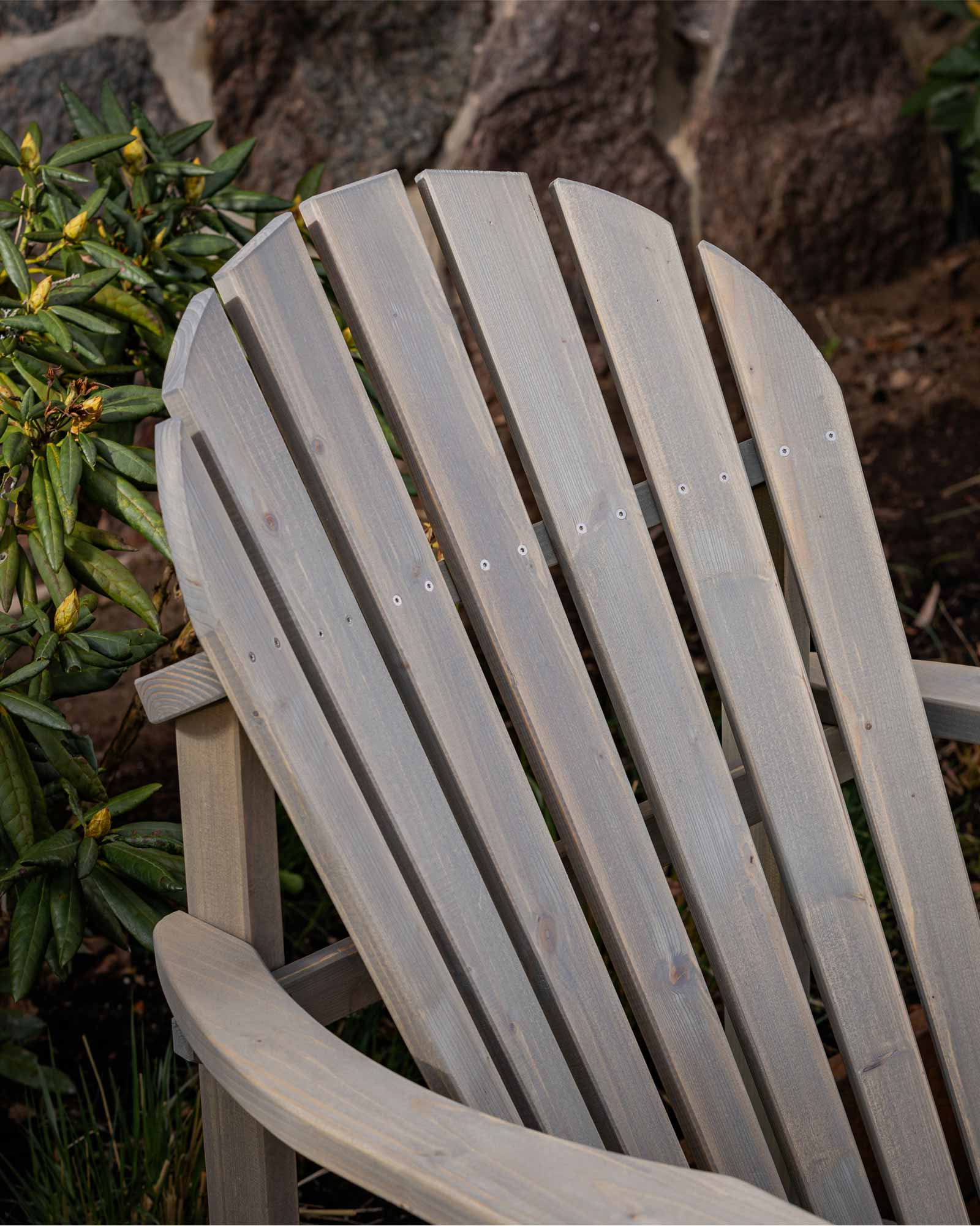 Closeup of the grey Adirondack chair's backrest