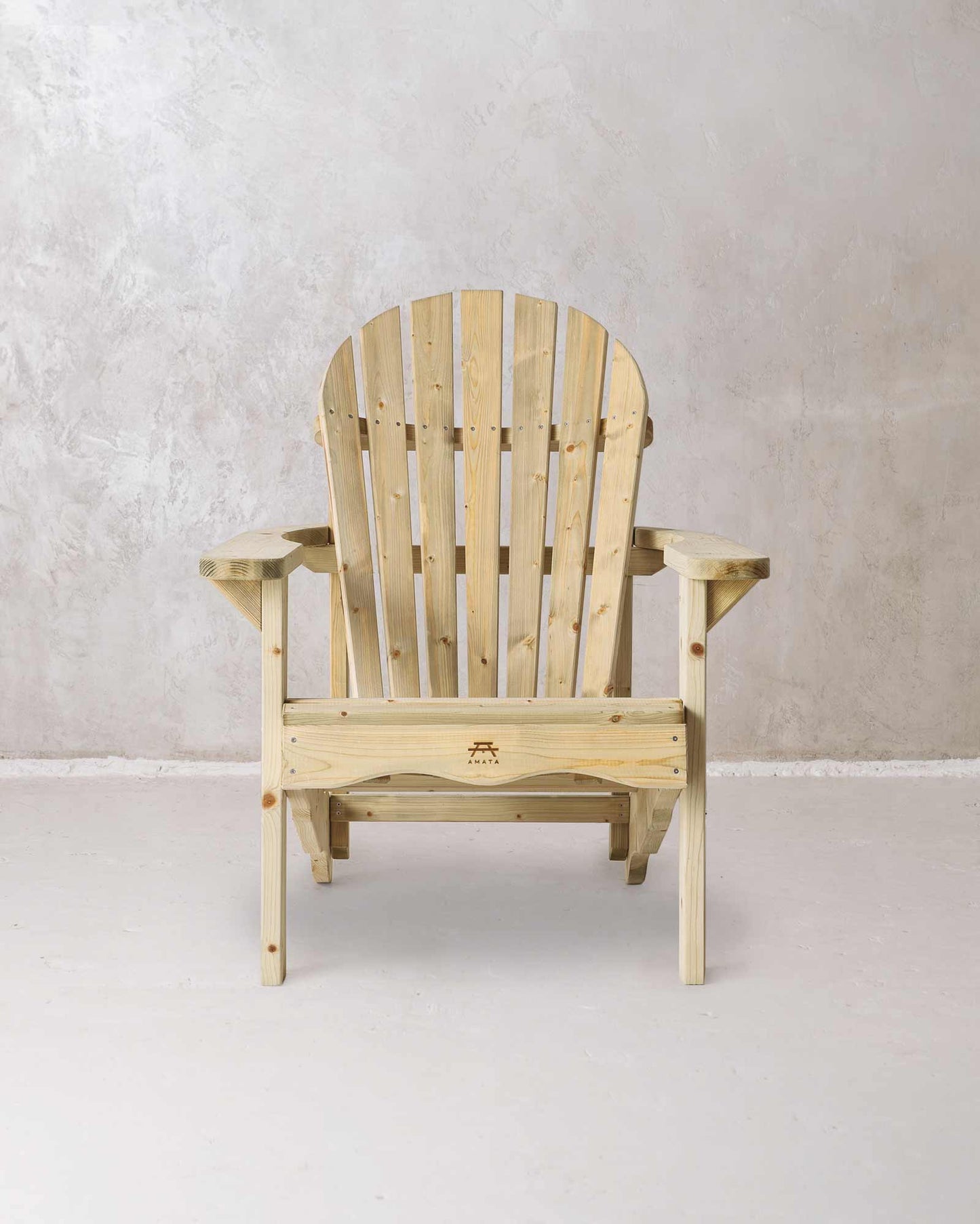 Green wooden Adirondack chair set on a concrete background, photographed from the front