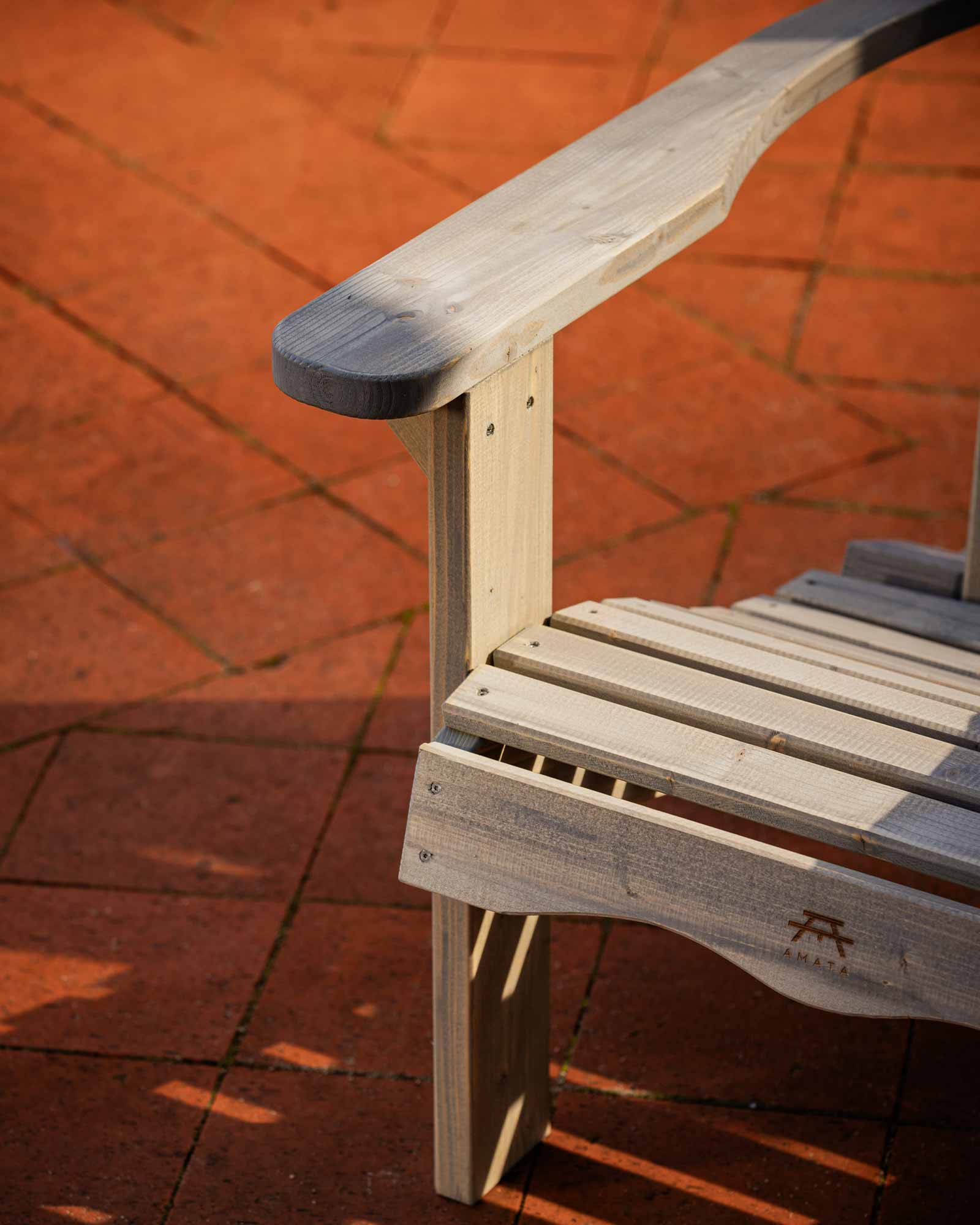 Closeup of the screw fastenings for the grey Adirondack garden chair legs