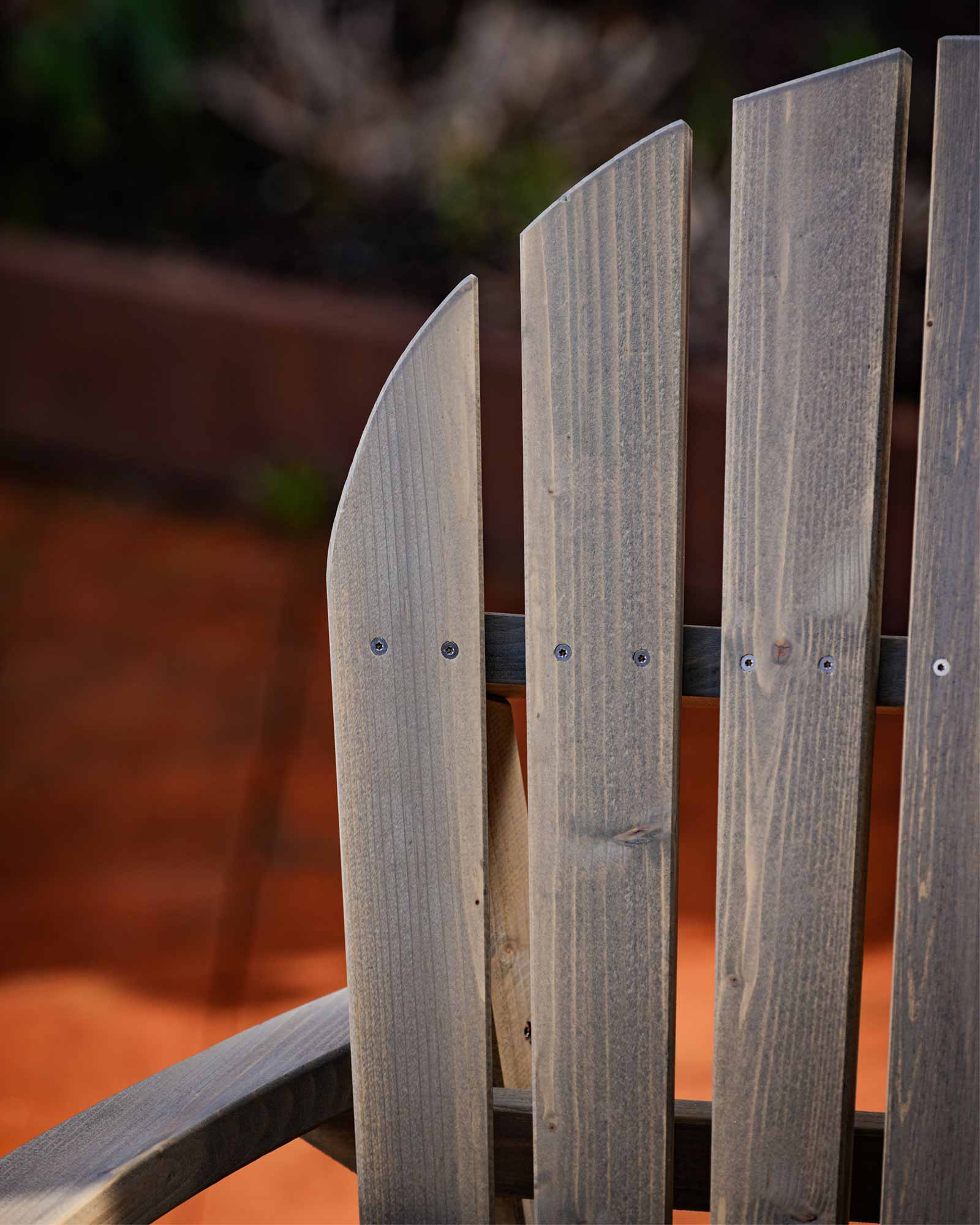 Details of the screw fastenings for the grey Adirondack garden chair