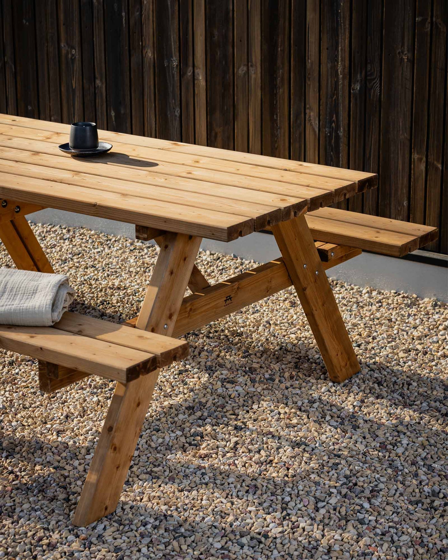 Closeup of a brown wooden picnic table outside