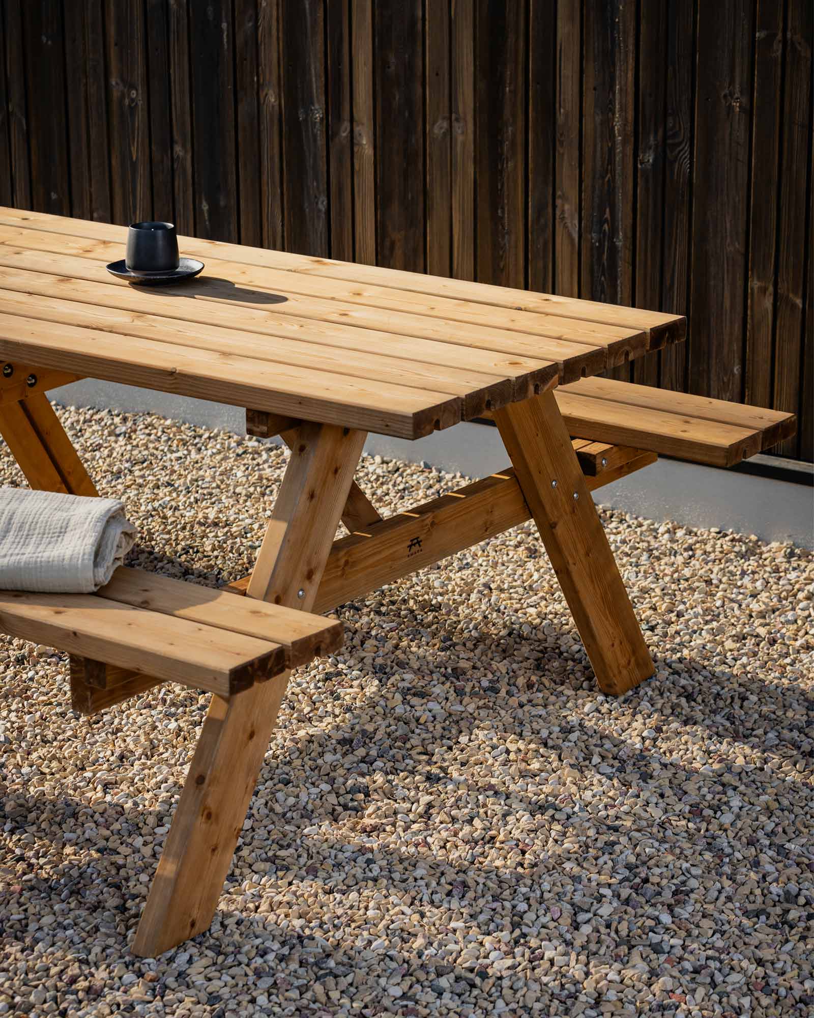 Closeup of a brown wooden picnic table outside