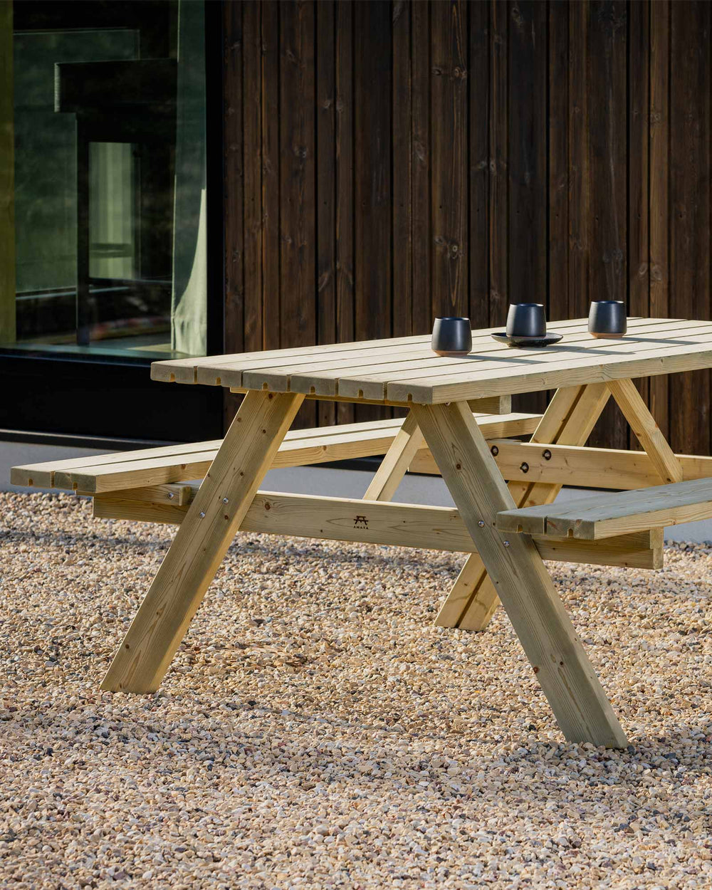 Green picnic table with 3 espresso mugs
